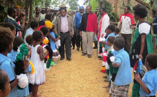 Dr. James Kintwa (right) leading Mr. William Duma and other leaders to the opening of Tipuka Community Health Post.
