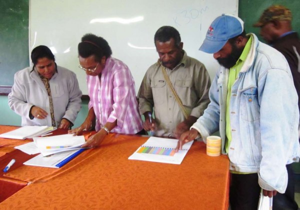 Some staff about to sign their contracts