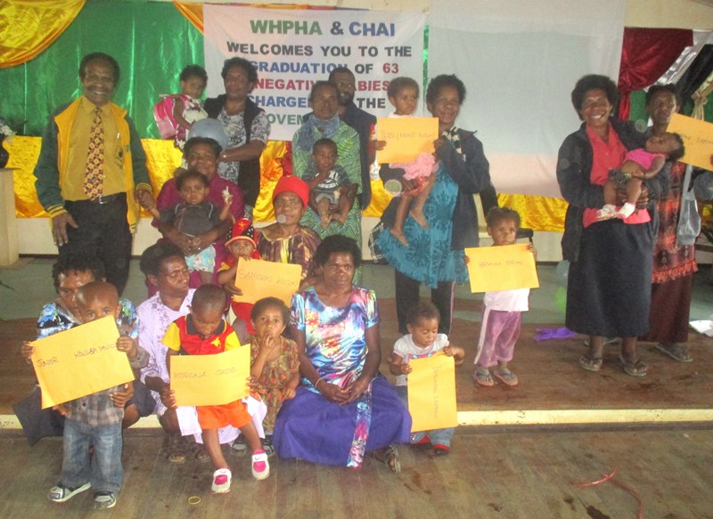 Some of the HIV-negative children are pictured with their parents during their graduation.