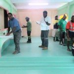 Emergency Physician, Dr John Junior McKup checking a patient who had just been treated at the emergency unit before admitting her to the ward for further observation and treatment.