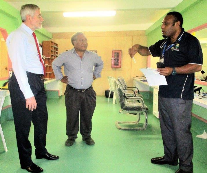 Emergency Physician, Dr John Junior McKup (right) makes a point during the Chairman’s visit to the Emergency Department.