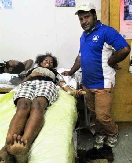 A Brian Bell employee is pictured giving blood.