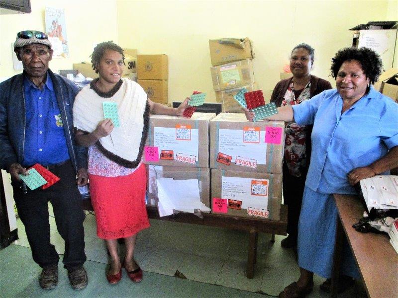 TB Clinic staff from right – Martha Kilya (CHW), Anna Koubuli (HEO), Roselyn Pakil (CHW) and Masua Pupu (CHW) displaying the boxes of drugs.