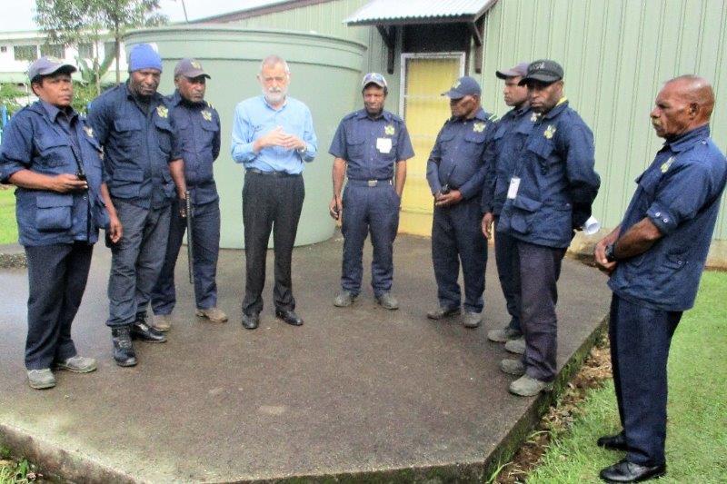 Chief Executive Officer, Mr. David Vorst officially launching the two-way radios, witnessed by a few security guards.