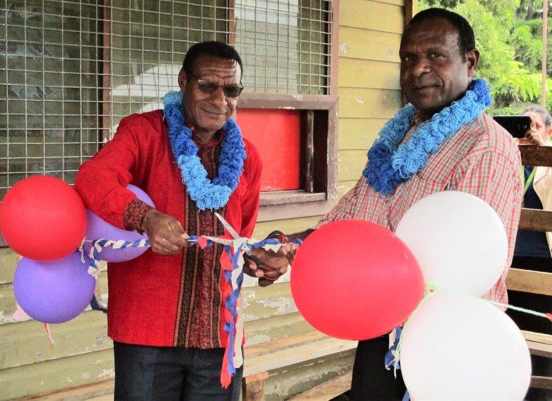 SDA Mission Health Director, Simon Peter (left) and WHPHA acting Director for Population Health, Dr Maddison Dat preparing to cut the ribbon to officially open the new veranda