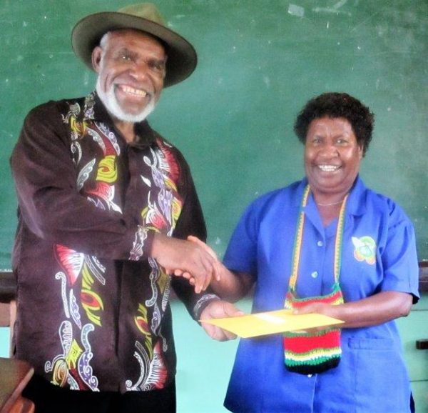 Long-serving employees receiving their certificates of recognition from the Deputy Chairman, Mr Michael Pundia.
