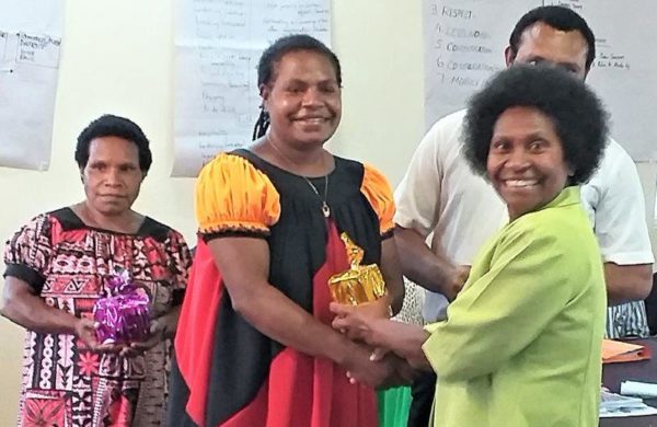 The trainers were presented with gifts and pictured is Nellie Newman receiving her present.