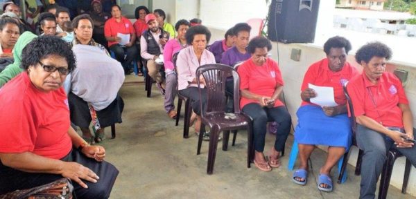 Staff, the two babies and their parents gather to observe the day.