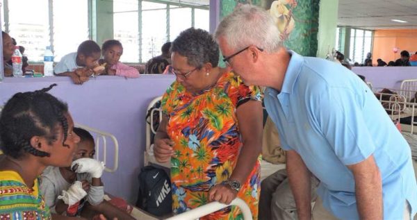 Tininga Group owners, Pat and Maggie Duckworth chatting with a mother and her child.