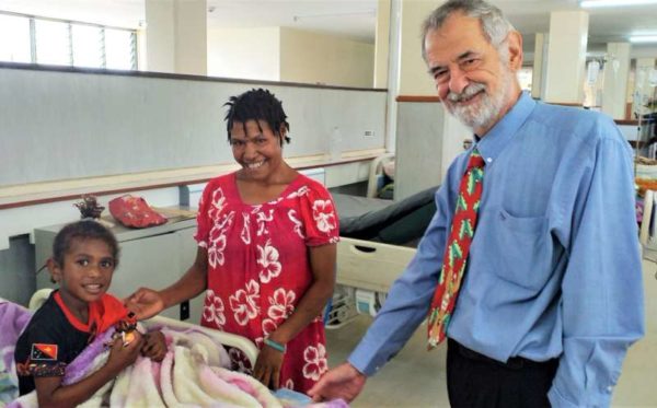 WHPHA CEO, David Vorst greets a child.