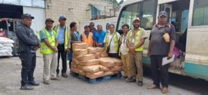 WHPHA Health Inspectors pose for a group photo with representatives from provincial agencies including NAQIA, Customs, Immigration, and Mt. Hagen City Authority, during the loading of the 178 cartons of chicken cocktails, which were prepared for disposal.