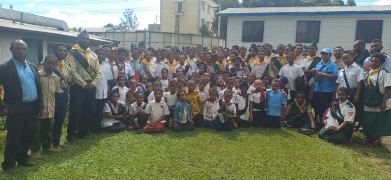 Pastors, Elders and Mothers from the Kelua 2 SDA Church gather for a group photo in front of the hospital Theatre unit