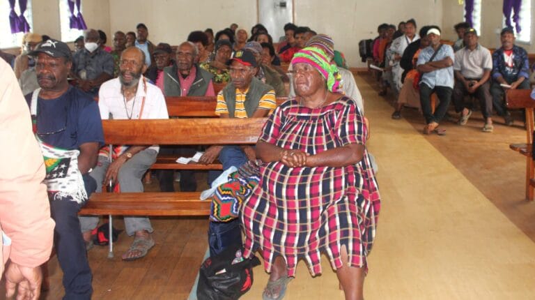 Retirees and relatives gather inside the Hospital Chapel to witness the farewell ceremony