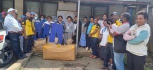 Hospital Staff and Litehaus International Reps pose together in front of the Administration Car park during the presentation of the 400 scrubs to the nurses of Mt Hagen Hospital