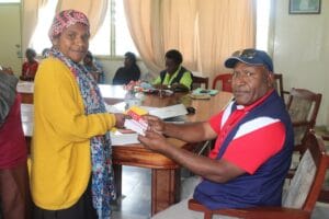 A VHA receives Flex Cards, courtesy of World Vision
