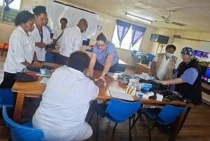 Nurses Jodie Mayers and Janet Hassall from St. Vincent Hospital engage with staff at Mt. Hagen Provincial Hospital
