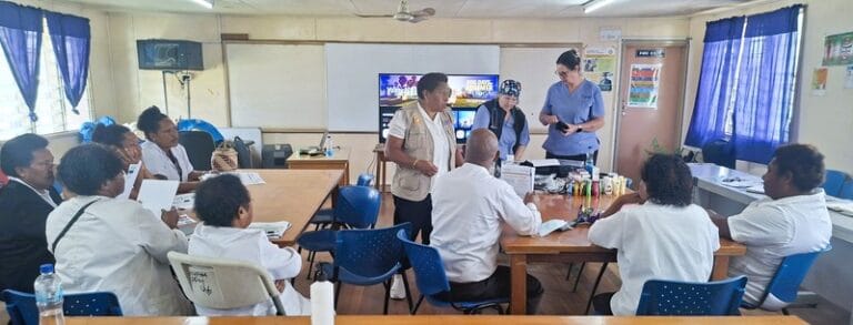 Nurses Jodie Mayers and Janet Hassall from St. Vincent Hospital engage with staff at Mt. Hagen Provincial Hospital