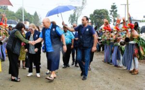 Dr. Saia Mau Piukala greets WHPHA Acting CEO Jane Holden