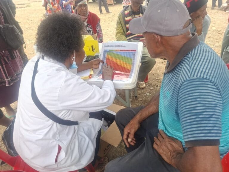 A nursing officer delivers a health talk to a patient at Pope's Oval, during World Heart Day