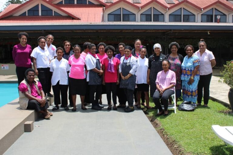 Highlander Hotel staff and Team WHPHA pose for a group photo after the Breast Cancer Awareness session