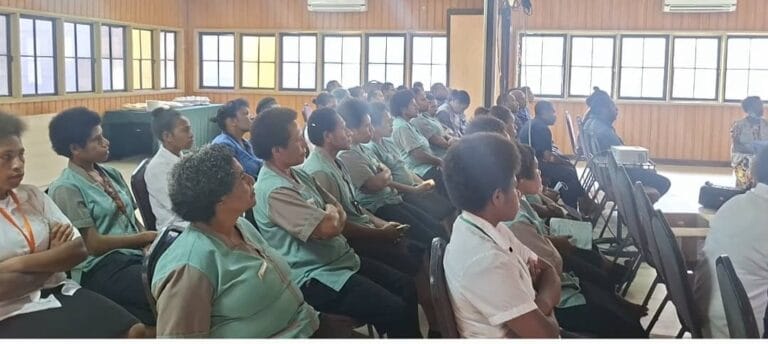 Highlander hotel staff listening attentively to WHPHA staff giving awareness messages and presentations at Highlander Hotel Pool Side conference room