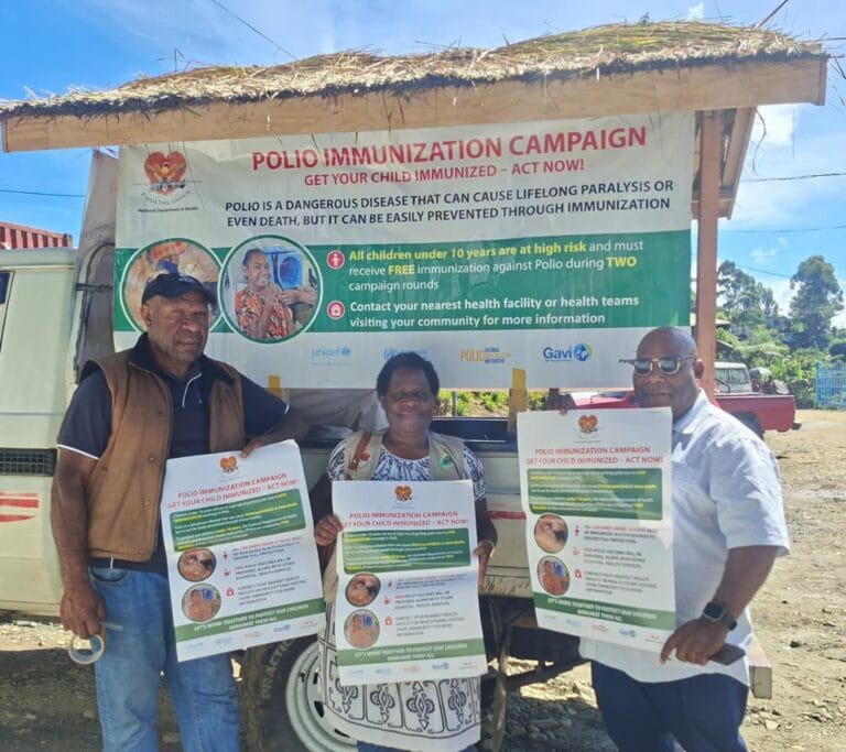 (R-L) Population Director Dannex Kupamu, DHPO Elizabeth Pundu and Provincial Educator Philip Kond pose for during the second round of the Polio Campaign
