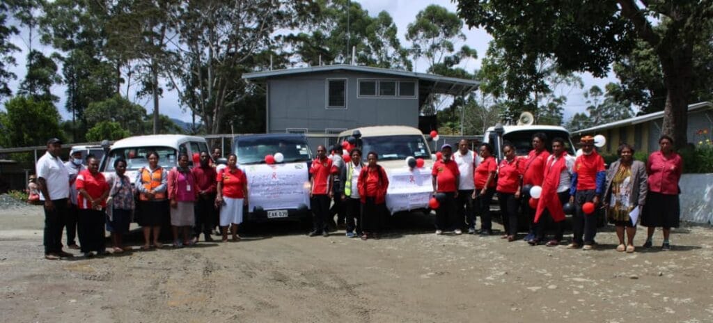 WHPHA staff, volunteers and partners pose for a group photo during World Aids Day