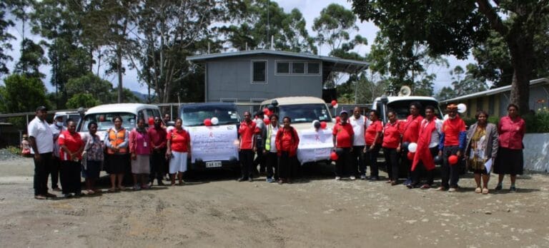 WHPHA staff, volunteers and partners pose for a group photo during World Aids Day