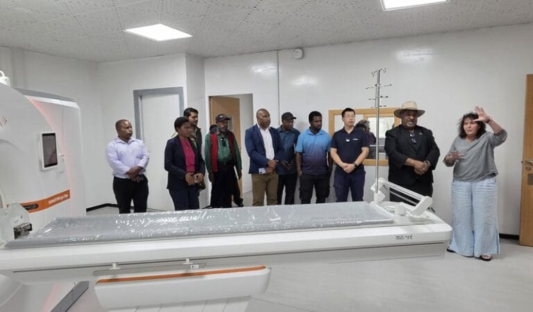 WHPHA’s acting CEO, Jane Holden, takes Governor Wai Rapa on a tour inside the CT scan room
