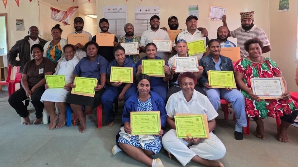 Healthcare workers from Baptist-run health centres in Mul Baiyer District proudly pose for a group photo after completing a week-long Nutrition Training, holding their Certificates of Participation