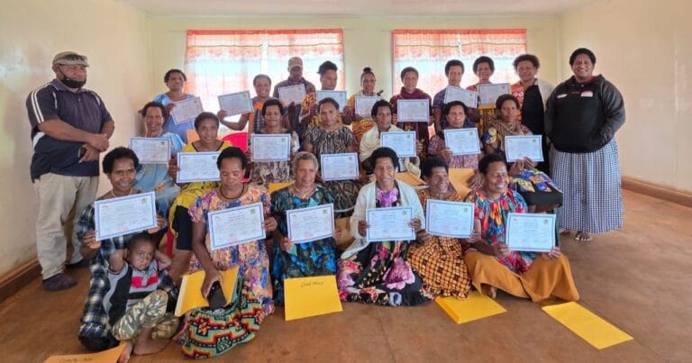 Certified Village Health Assistants (VHA) pose for a group photo after a one-week training on Nutrition.