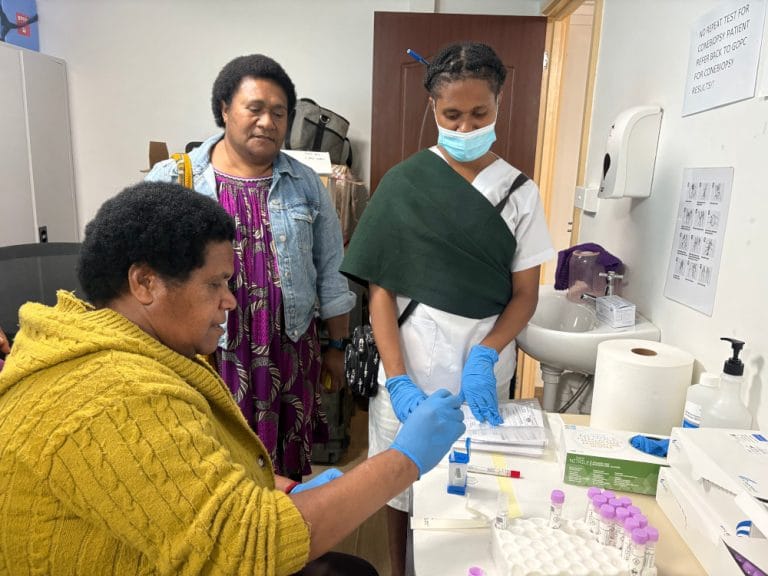 Sr. Robert gains hands-on experience as WHPHA staff, Sr. Yamog and Sr. Munnul, observe her work.