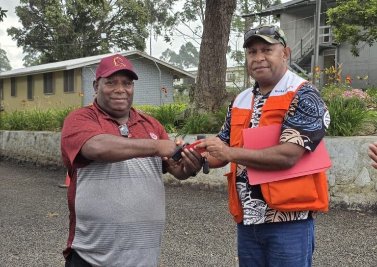 L-R Director for Public Health Mr. Dannax Kupamu receives vehicle key from World Vision’s Grants Operation Supervisor Mr. Richard Kebo
