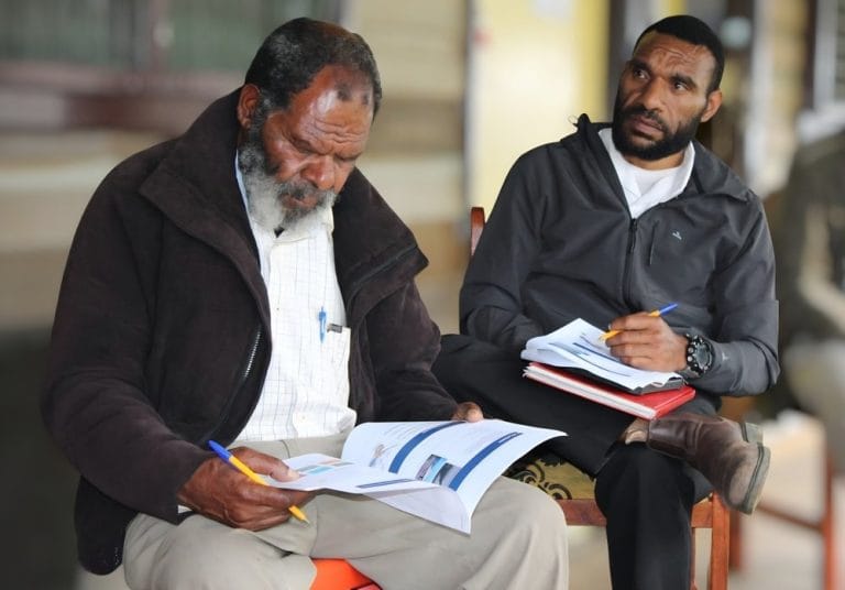 L-R Tambul Health Center Nursing Officers; Mr. William Kiapson and Officer-in-Charge Mr. Ray Aiya attentive and engaged throughout the session.